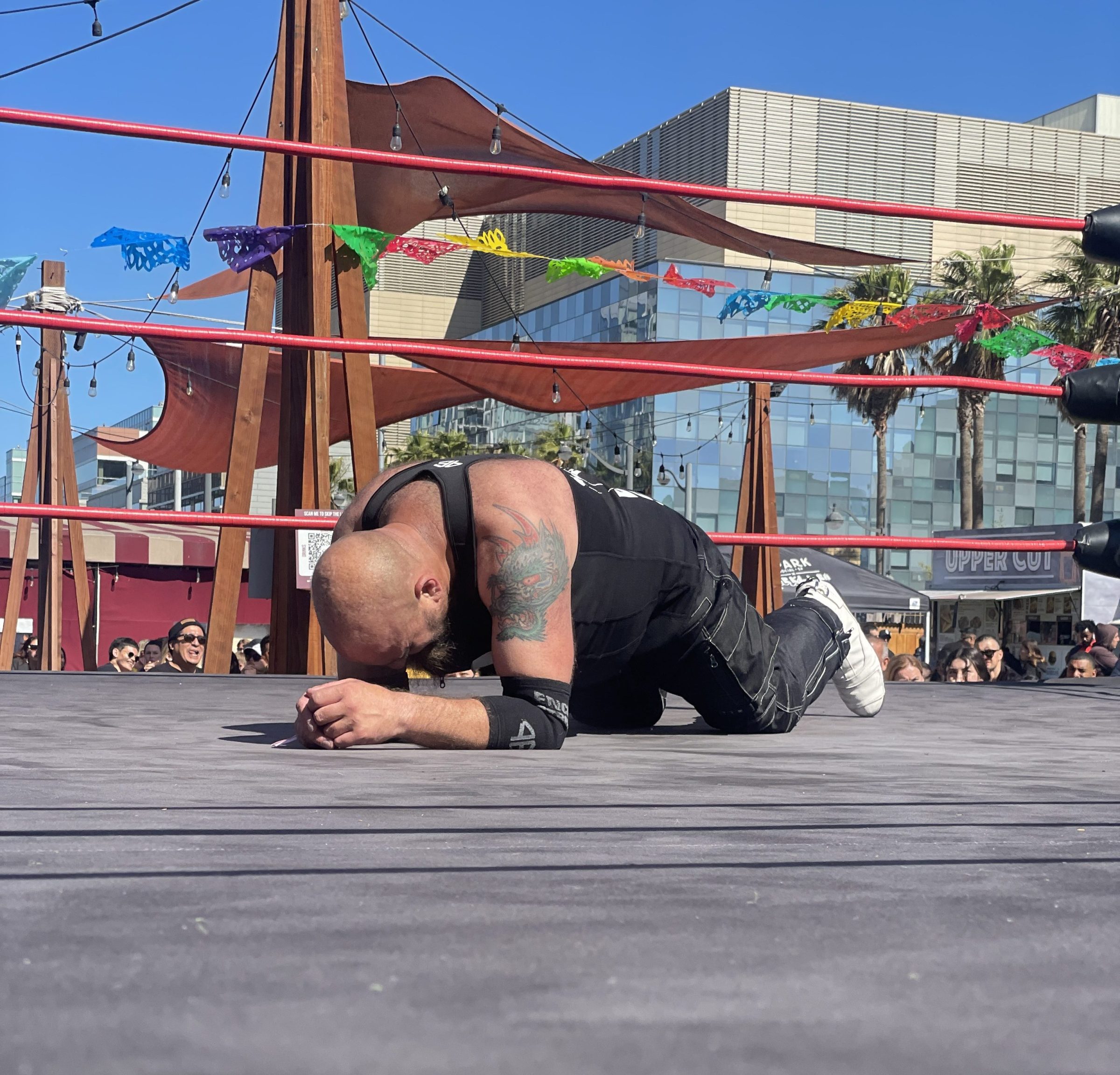 a person laying on wrestling ring